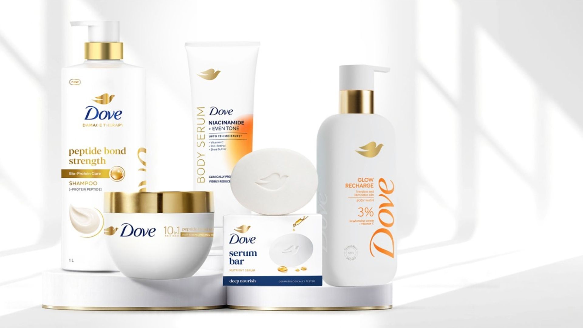 Assorted Dove skincare and haircare products arranged on a white display stand
