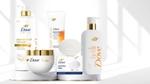 Assorted Dove skincare and haircare products arranged on a white display stand