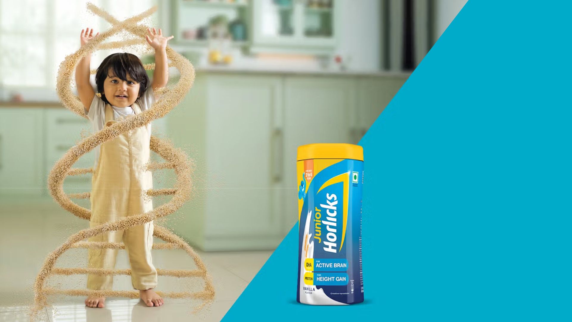 A young child with their hands up above their head with a Junior Horlicks packshot 