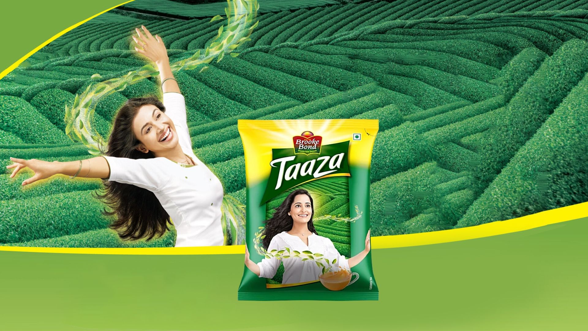 A woman waving her arms around in a tea field, with a packshot at the front