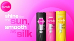 Three Sunsilk shampoo bottles in black, pink, and yellow against a vibrant pink gradient background with text 'shine like the sun, smooth as silk.'
