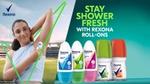 Smiling woman applies deodorant with a backdrop of a stadium. Text reads "Stay Shower Fresh with Rexona Roll-Ons." Various roll-ons are displayed.