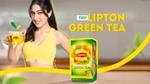 Woman holding a cup of Lipton Green Tea