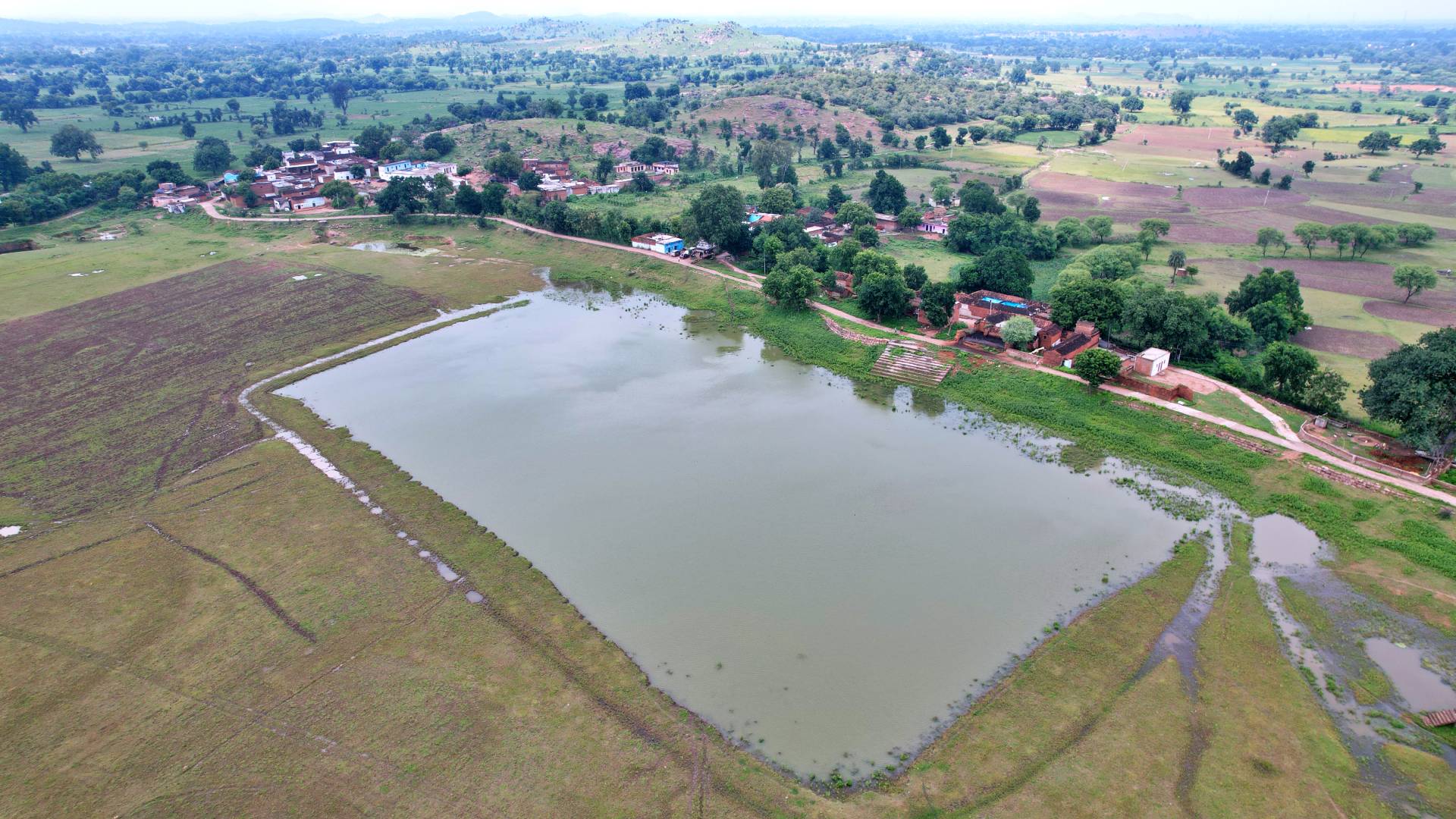 a river with a small town in the background