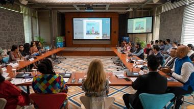 Prashanth Venkatesh, Marketing & Sustainability Director, HUL showcasing how the toolkit allows customisation and replication of HUL’s behaviour-science led communication creatives to the group seated.