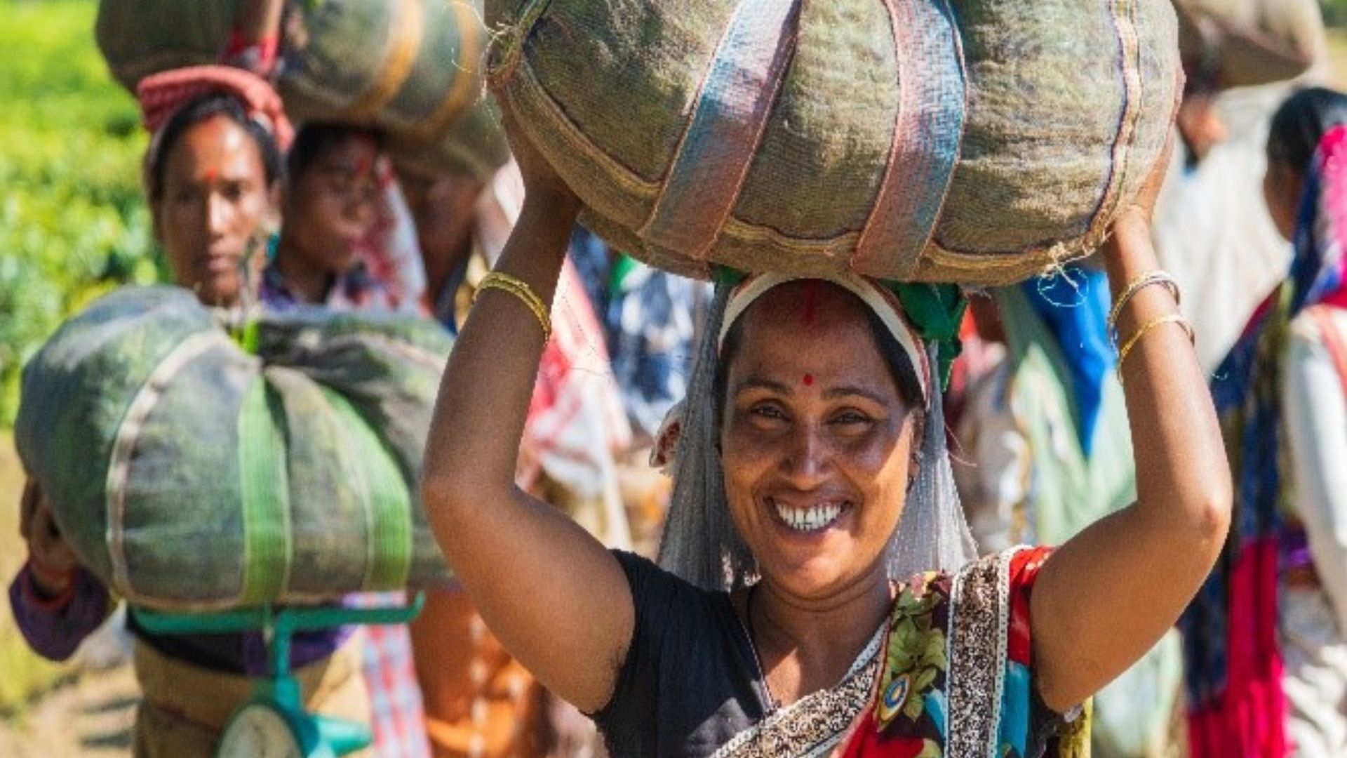 A woman carrying a bag on her head 