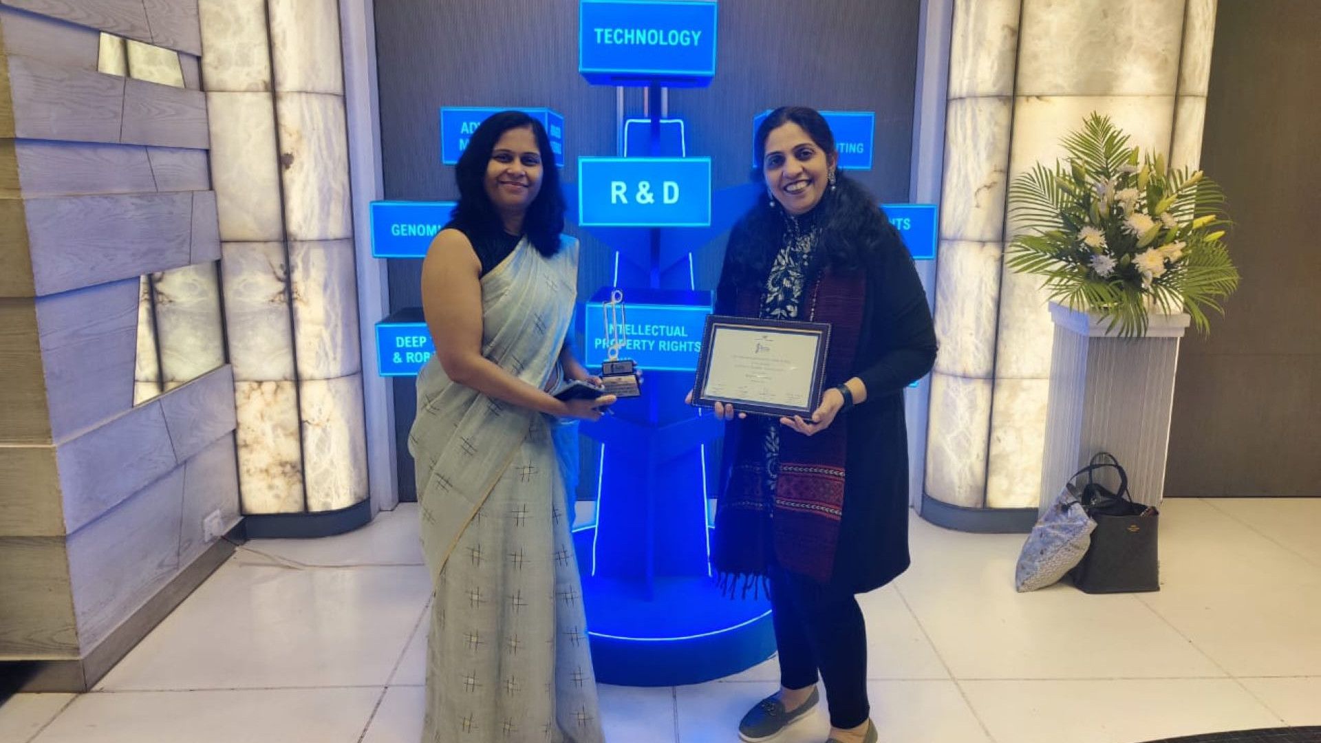 Two women with the CII Innovations Award for excellence in R&D.
