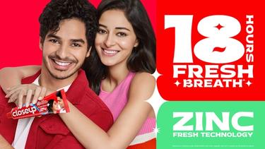 Two people with a Closeup product.