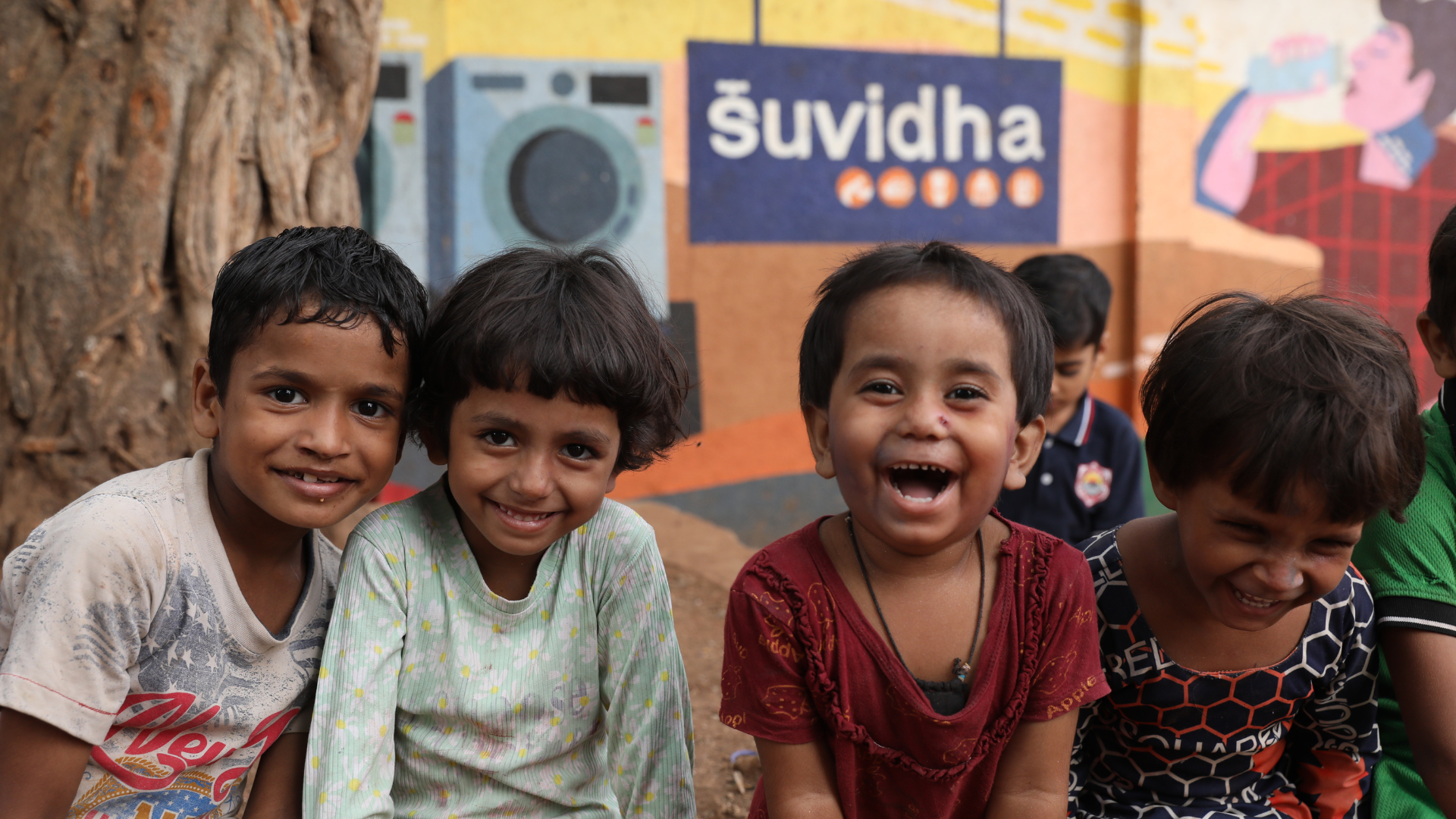 Happy children outside HUL Suvidha centre