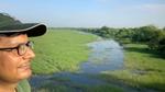 An image of HUF CEO Shraman Jha overlooking a wetland site.