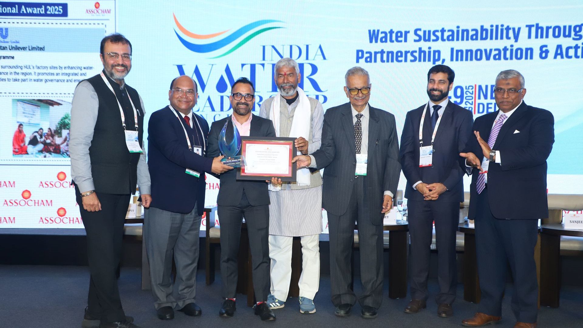 A group of 7 people with the ASSOCHAM National Water award and certificate.