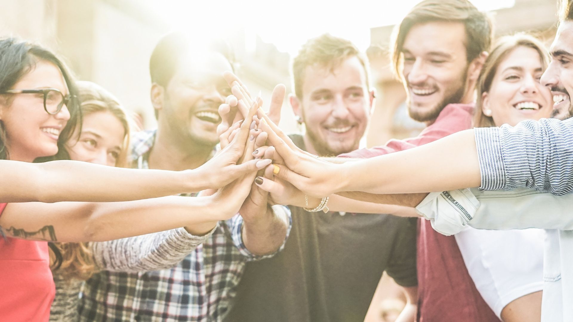 A group of people joining hands