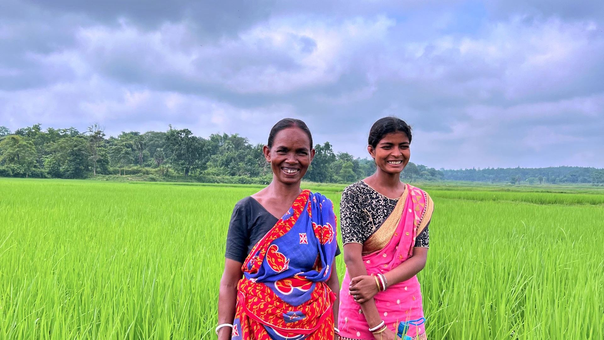 Two women in an agricultural field.