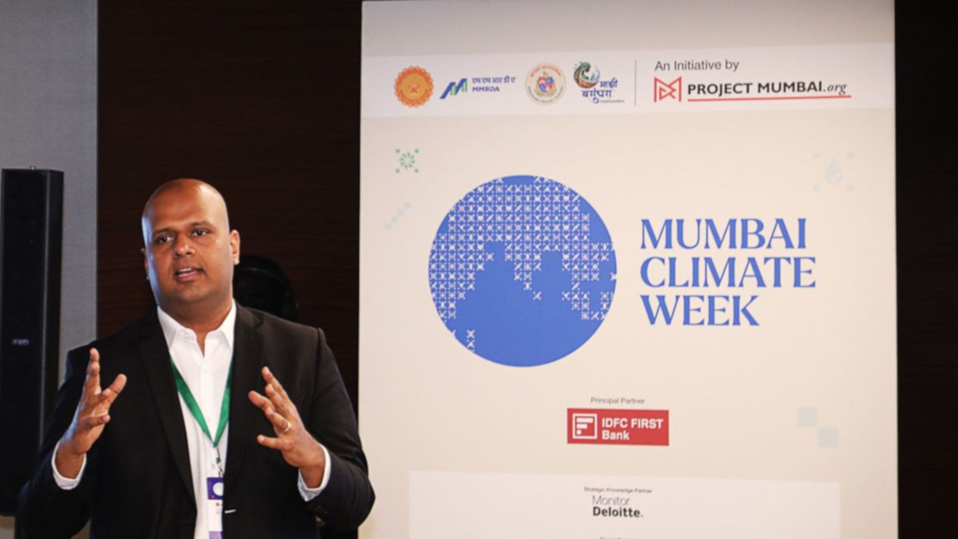 Person speaking at Mumbai Climate Week event.