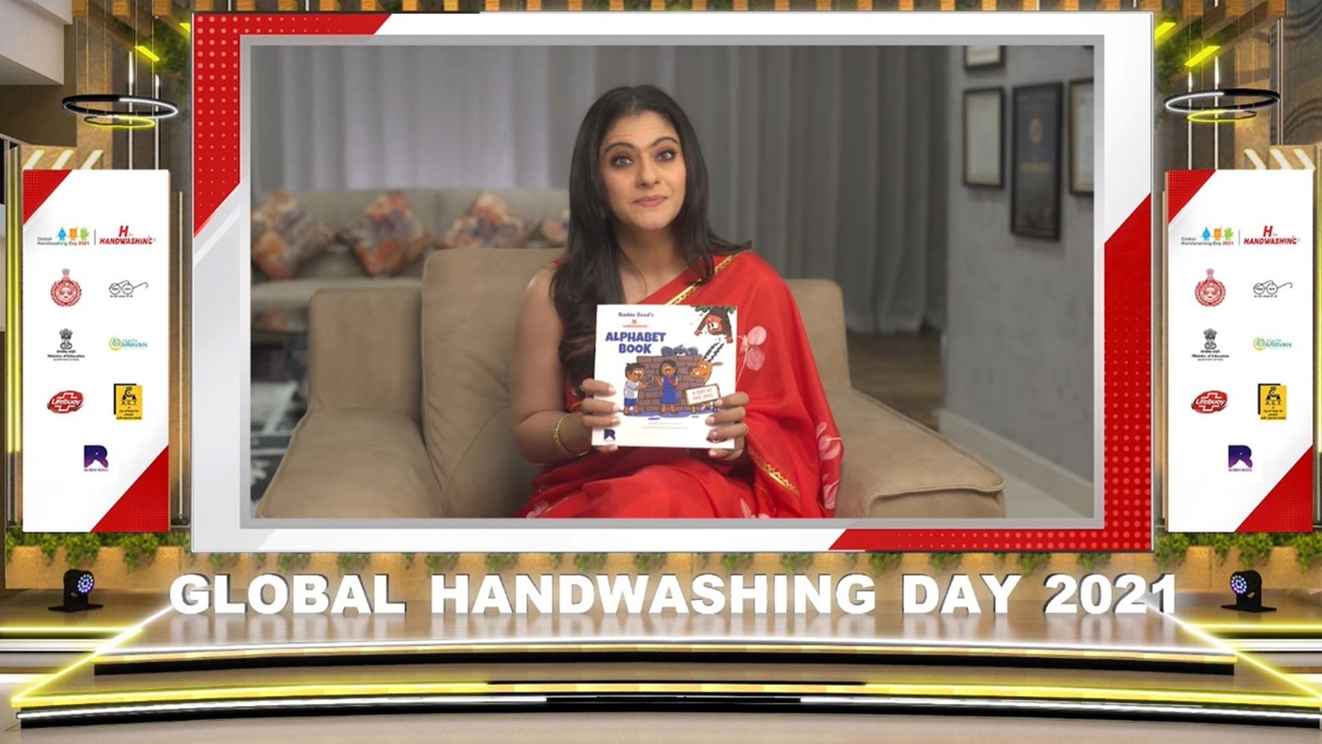 Kajol Devgn, Lifebuoy brand ambasaddor holding the H for Handwashing book by Ruskin Bond on Global handwashing day 2021 