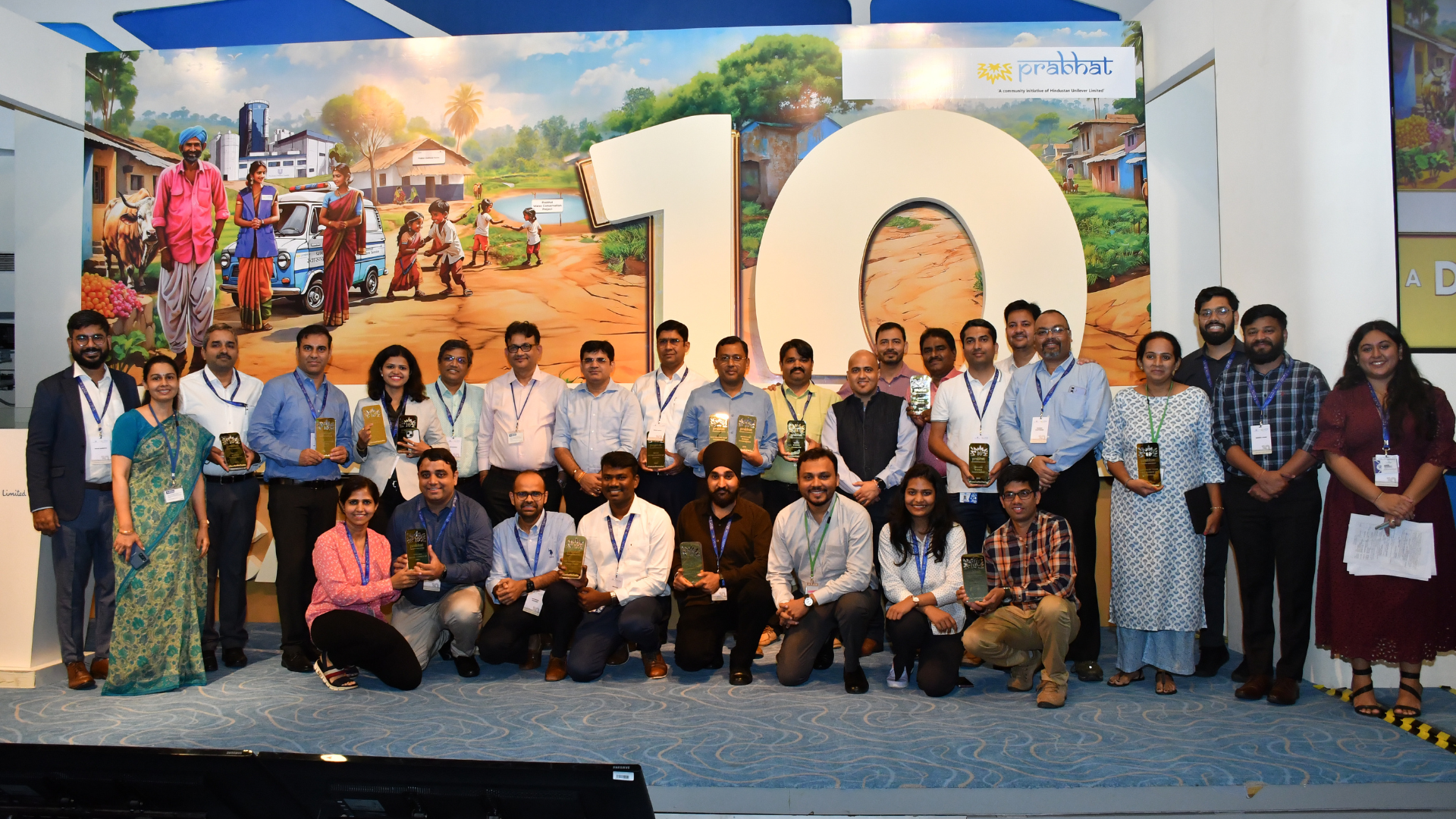 A team photo at an event to celebrate 10 years of HUL's Prabhat community development initiative