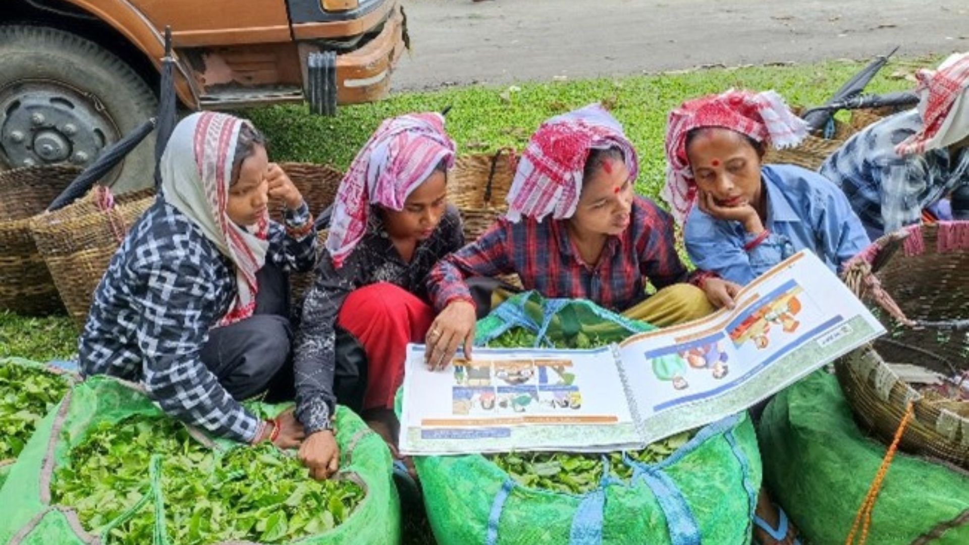 a group of women sitting and reading