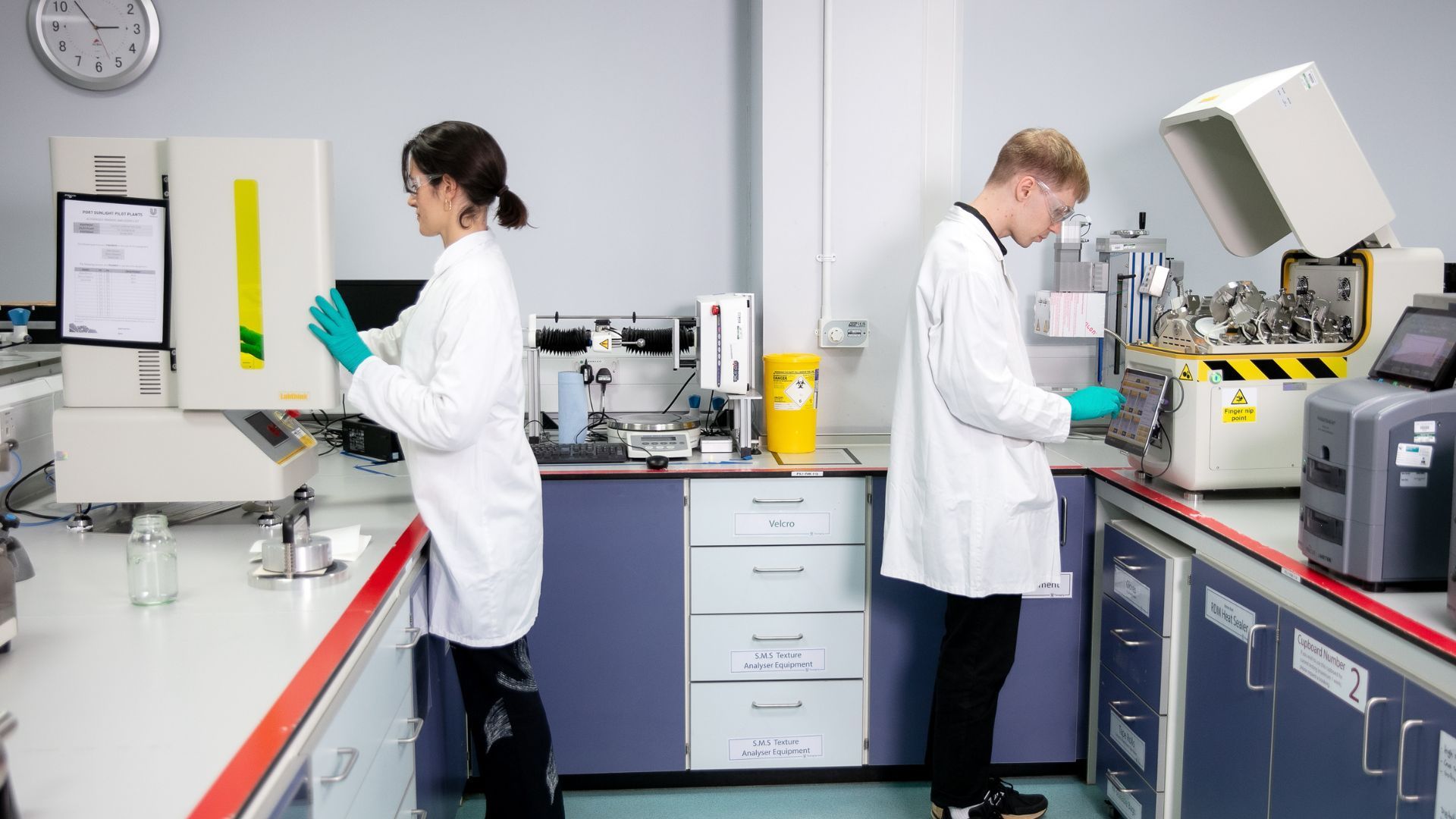 Two Unilever packaging material scientists testing samples to check their barrier properties against moisture, oxygen and light.