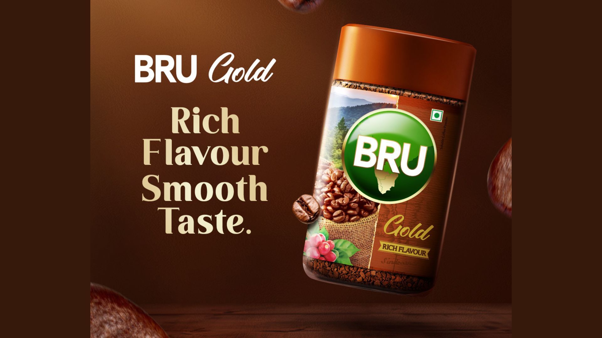 An advertising for a packet of Bru Gold Premium Instant Coffee with a background of coffee beans
