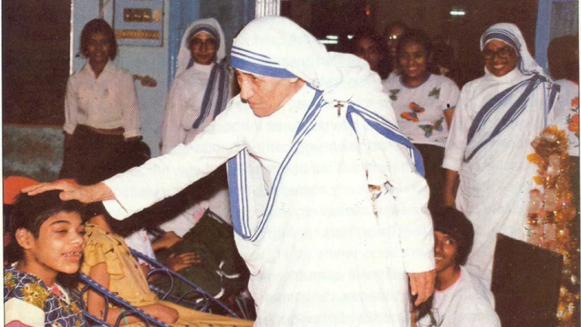 A picture of Mother Teresa blessing a young boy at Ashadaan, Byculla.