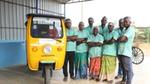 A picture of an electric vehicle used for collecting segregated household waste under HULs Prabhat program and a group of waste pickers.