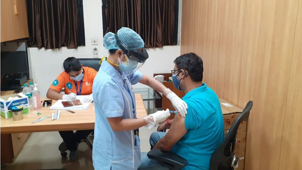 An image of a person taking the COVID19 vaccine