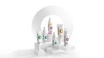 Novology skincare products displayed on white platforms with colorful labels and modern packaging