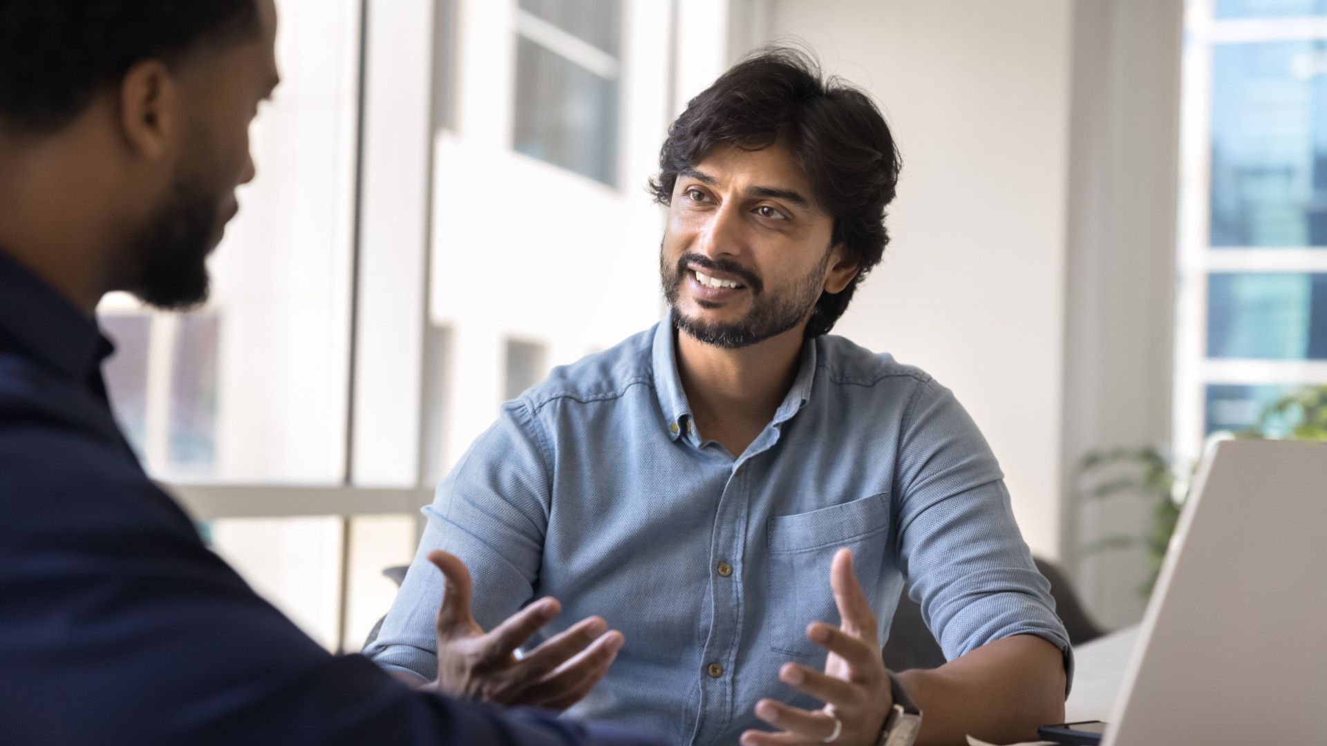 A male worker discussing with his colleague