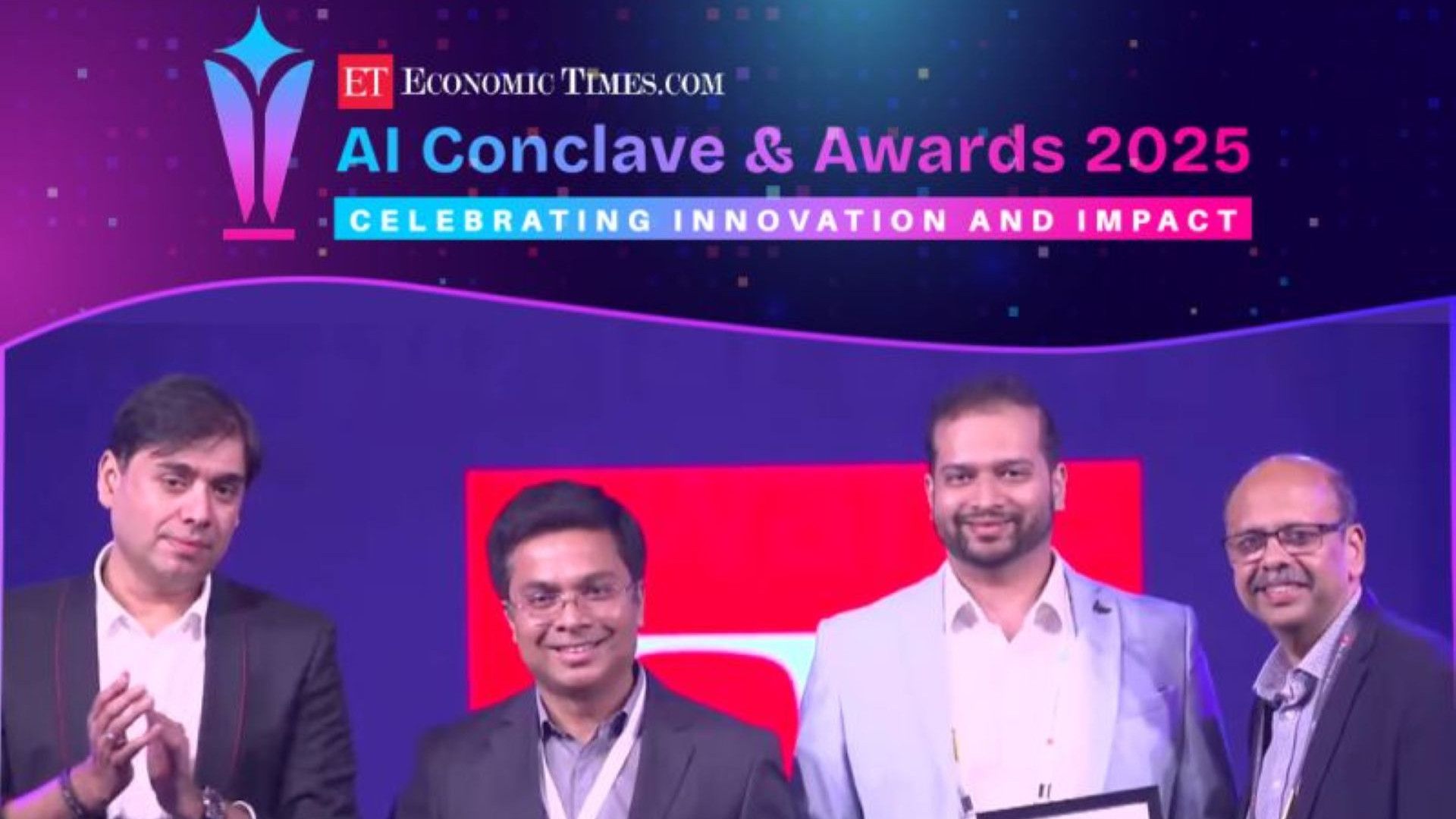 Four people at the ET AI Conclave & Awards 2025.