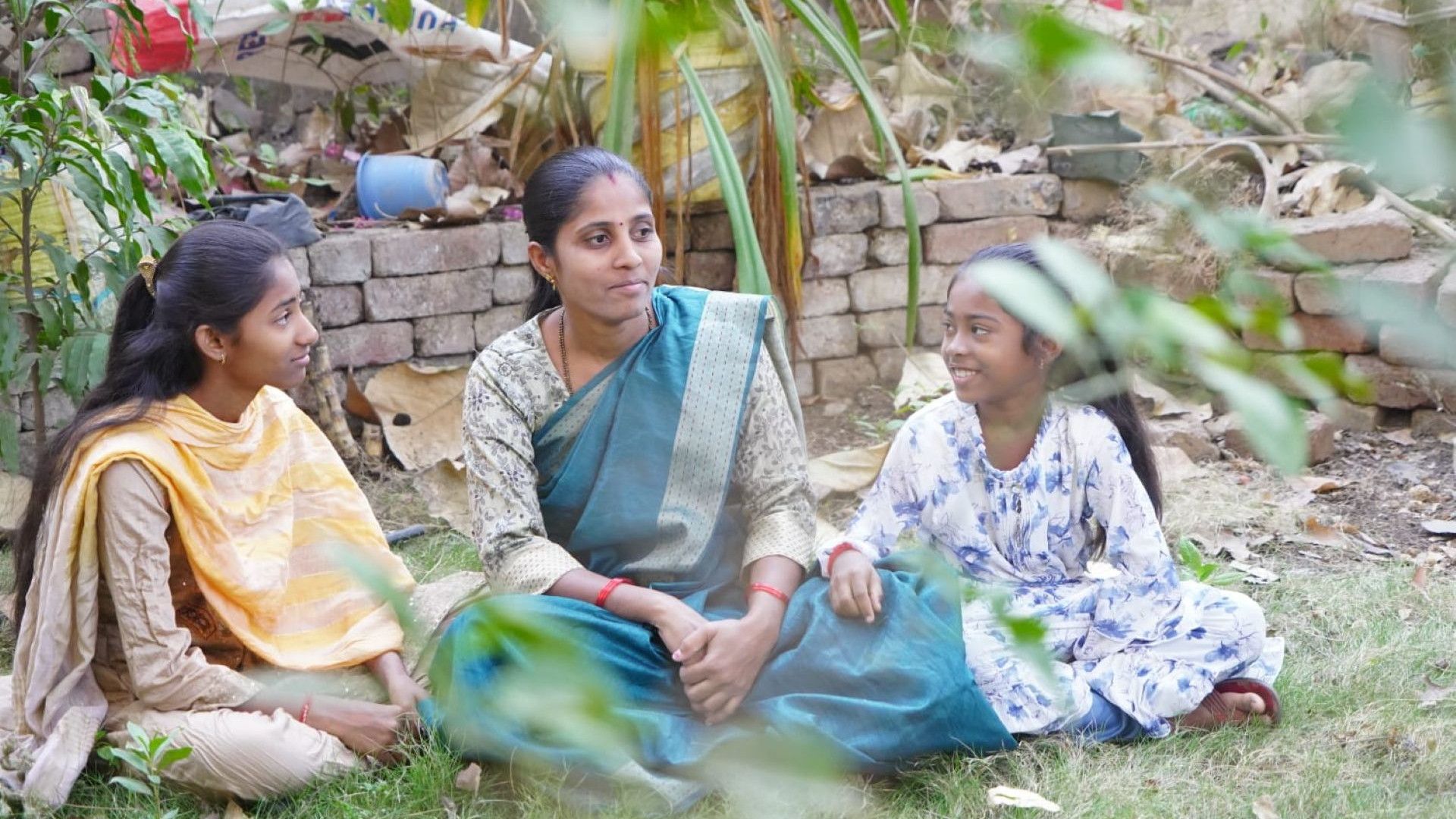 Dipali Thodasare alongside two girls.
