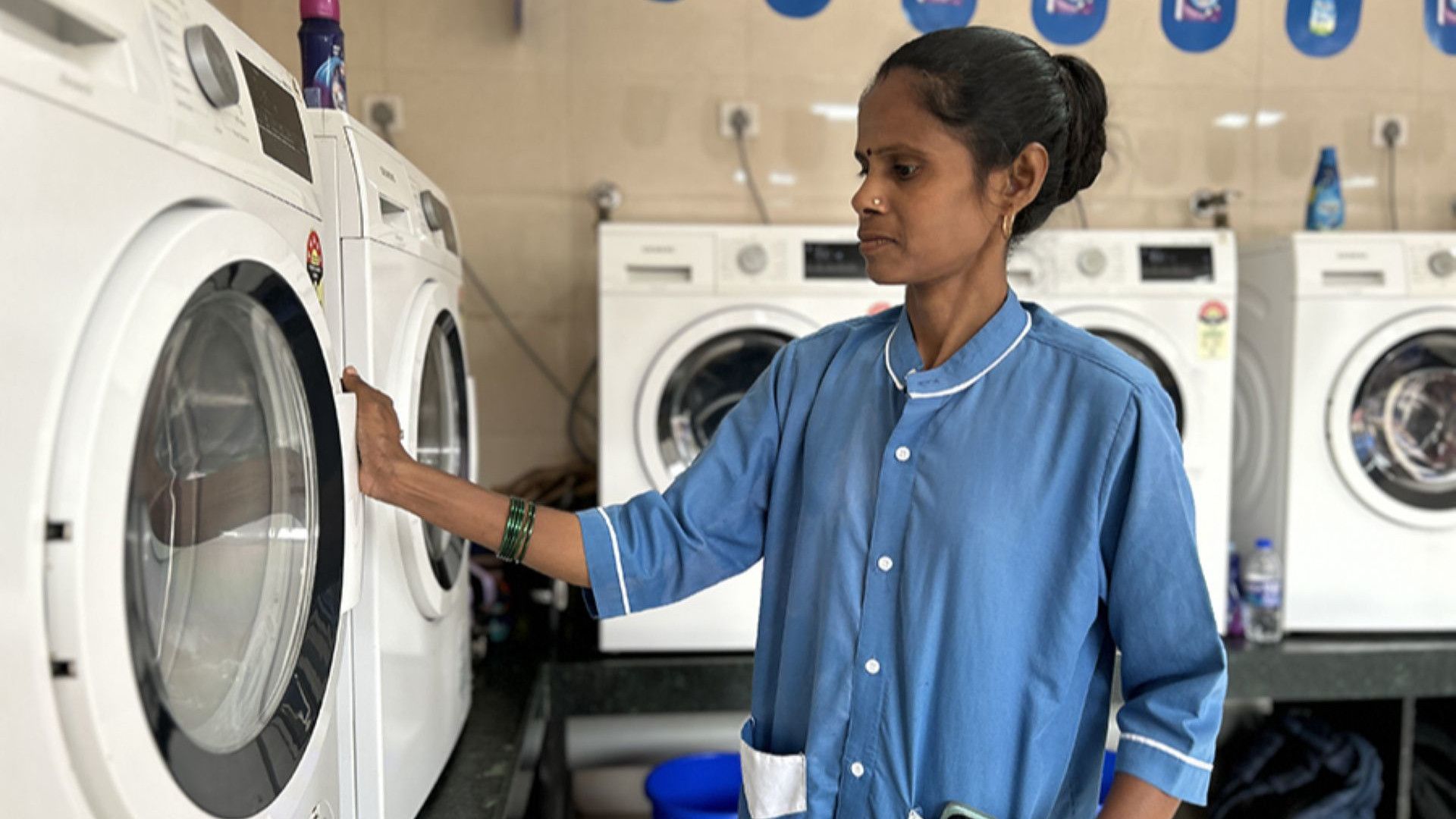 A lady worker at HUL Suvidha centre in the laundromat section 