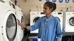 A lady worker at HUL Suvidha centre in the laundromat section