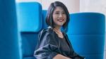 Khim Yin Poh, Lifebuoy Global Brand Lead, pictured sitting in a blue chair. She has dark shoulder-length hair and is smiling.