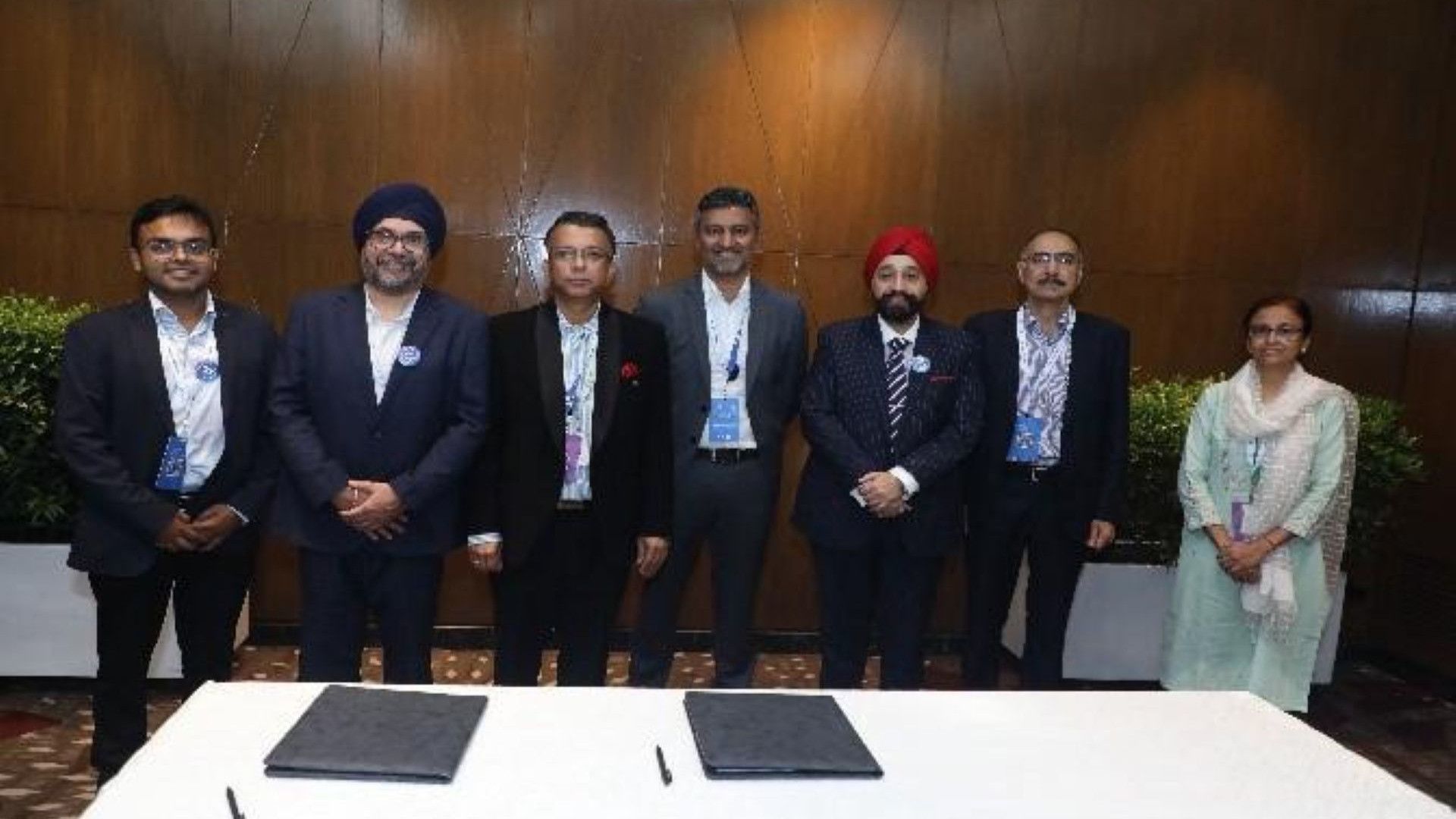 People accepting Sustainability Impact Award on stage.