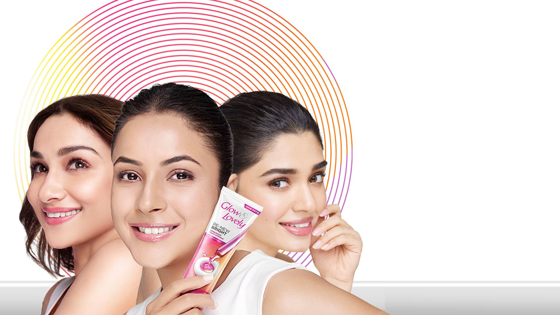Three woman with one person holding a Glow & Lovely product