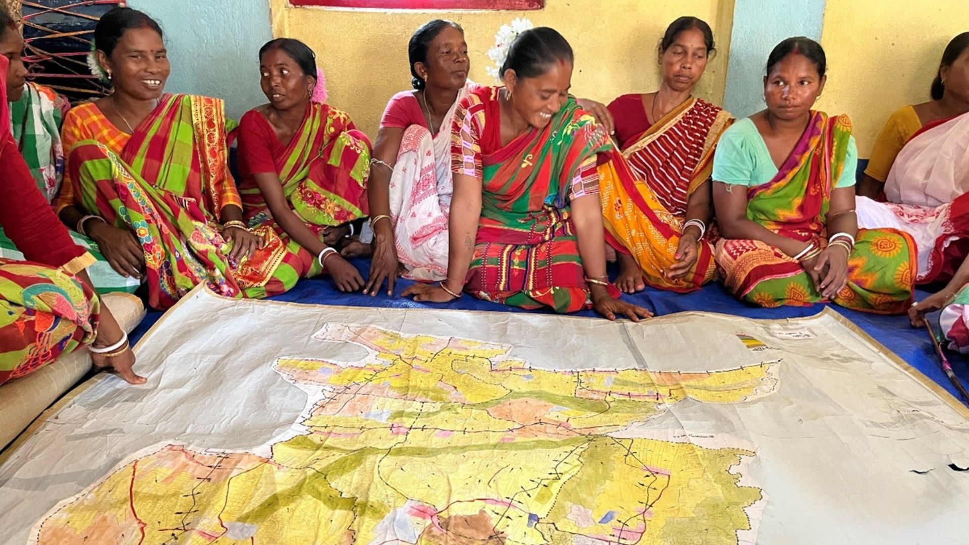 Tribal women preparing a watershed map 