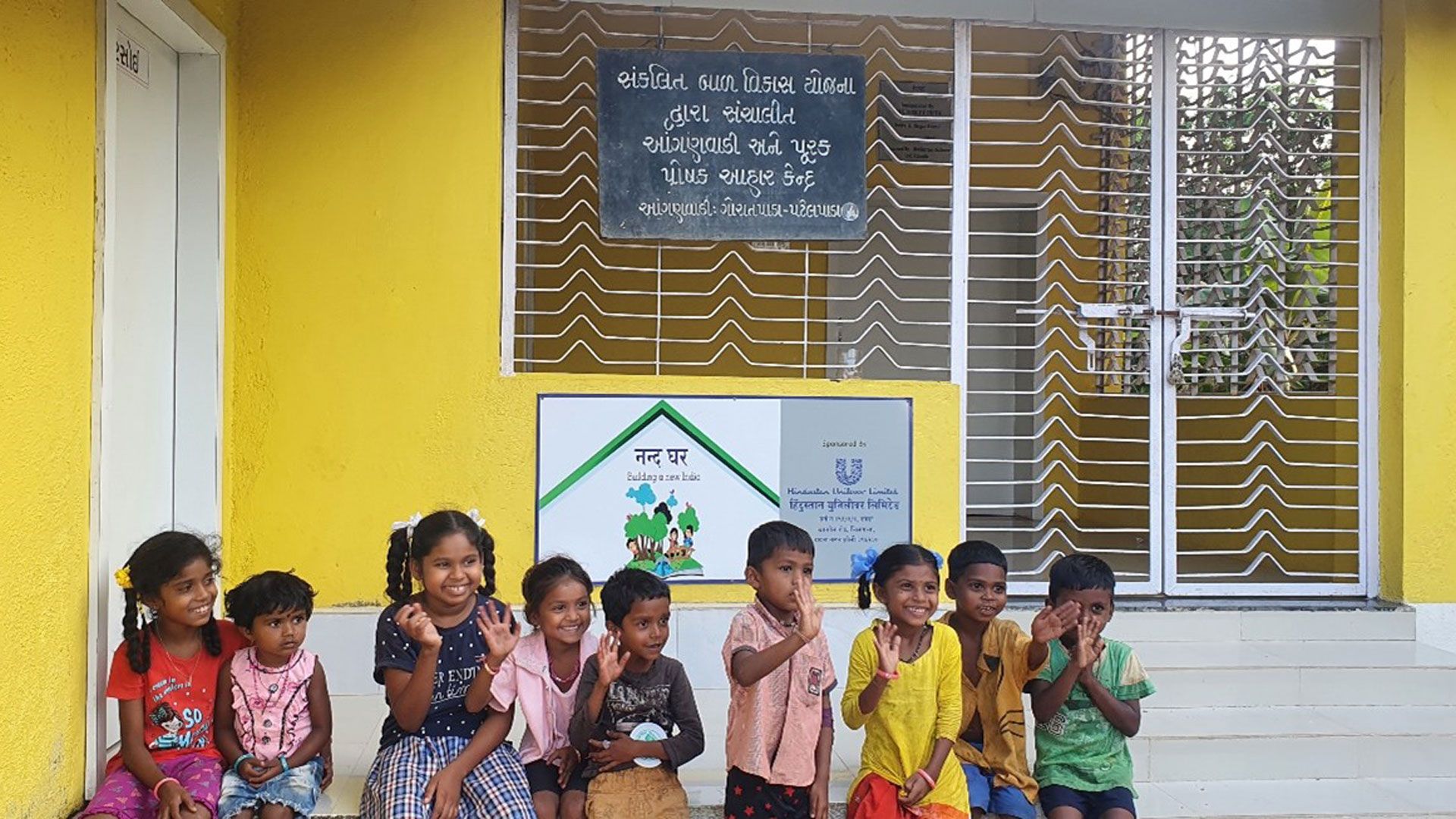 An image of children outside a school refurbished by HUL’s Project Prabhat 