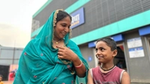A mother and child outside HUL Suvidha Centre