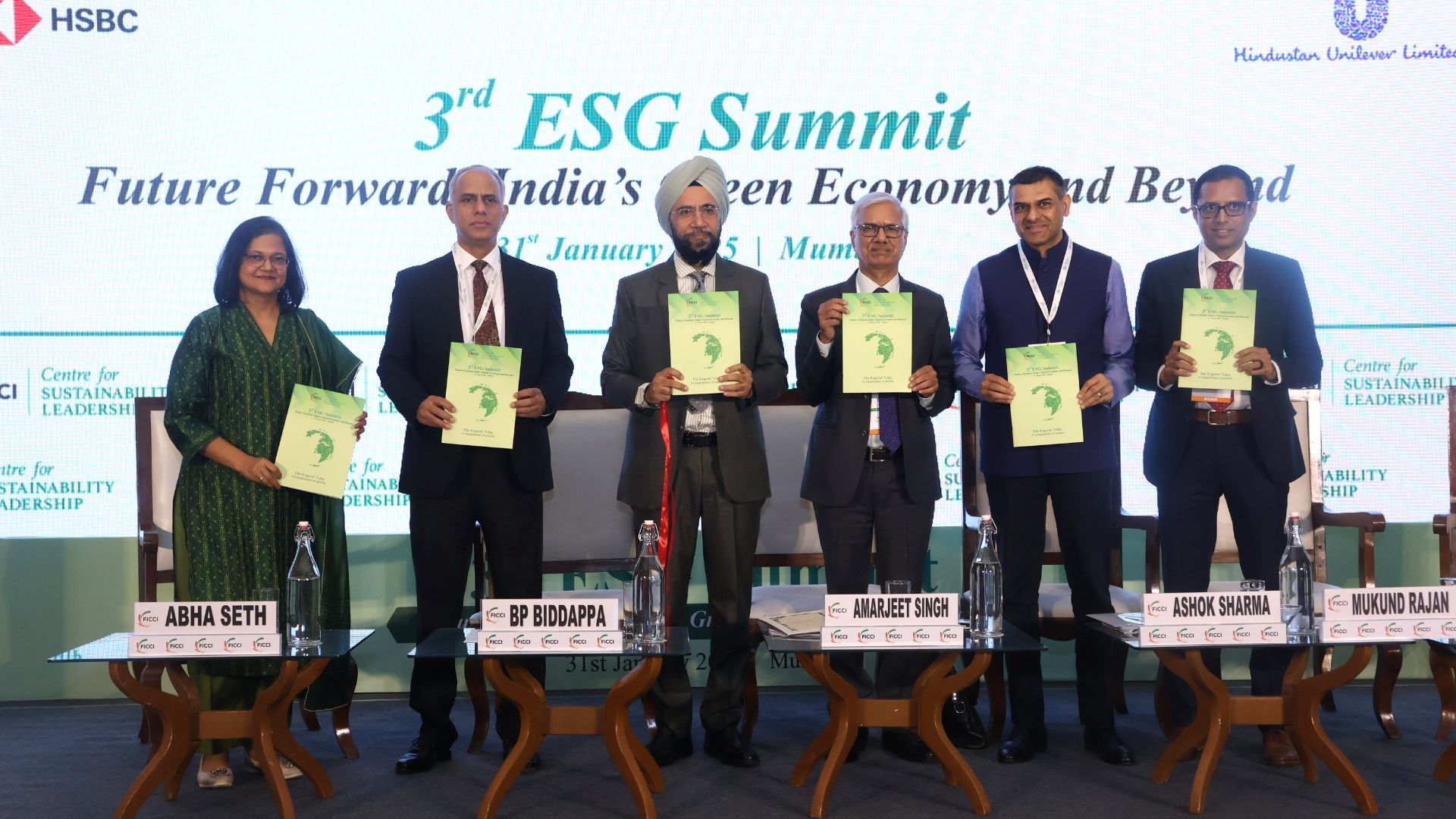 Mr B. P. Biddappa at the launch of Centre for Sustainability Leadership in partnership with Hindustan Unilever and FICCI. The picture includes a group of people holding a rectangular book. 