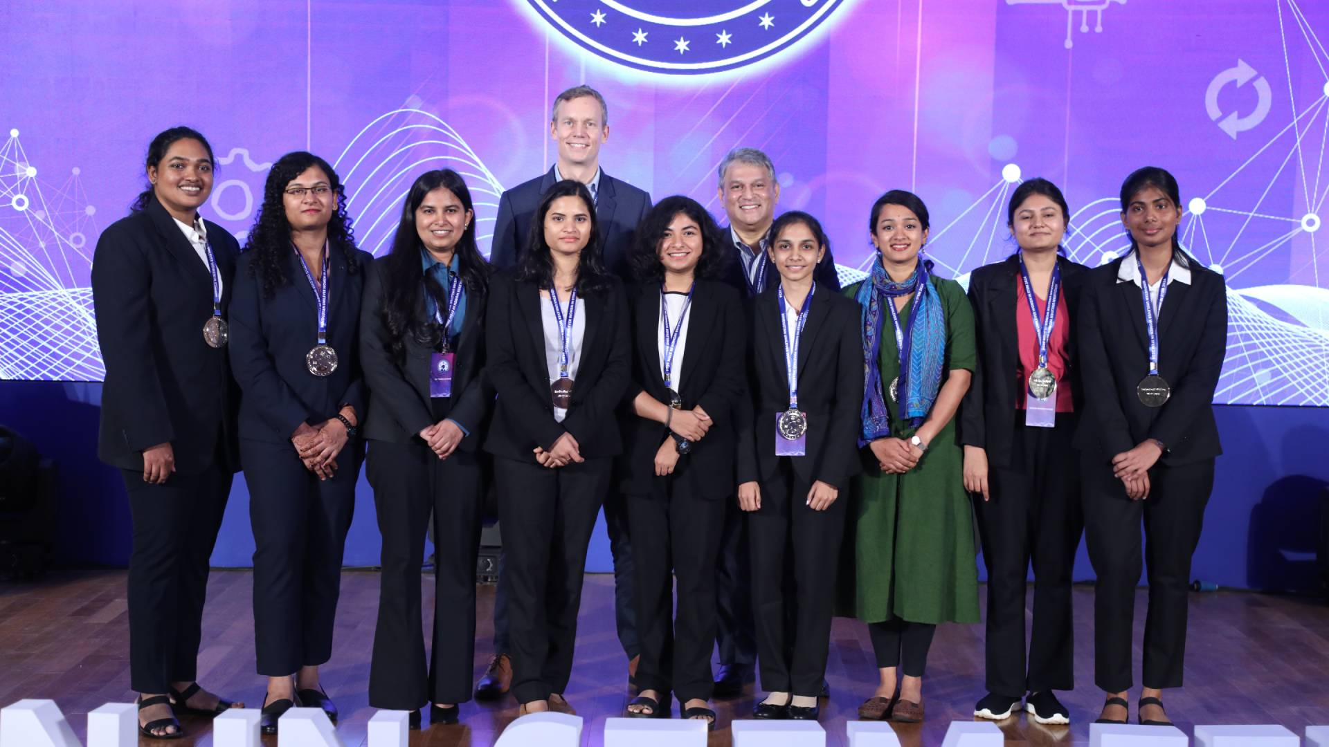 A group pic of HUL's Women in STEM fellowship in 2024.  The  picture includes senior R&D and sustainabilility executives from Unilever namely Richard Slater, Unilever's Chief R&D Officer, and Rebecca Marmot, Unilever's Chief Sustainability Officer. Dr Vibhav Sanzgiri, Executive Director R&D HUL is also seen in the picture.